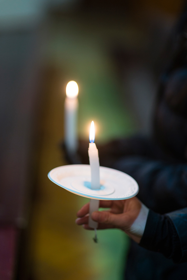 Hand holding a candle